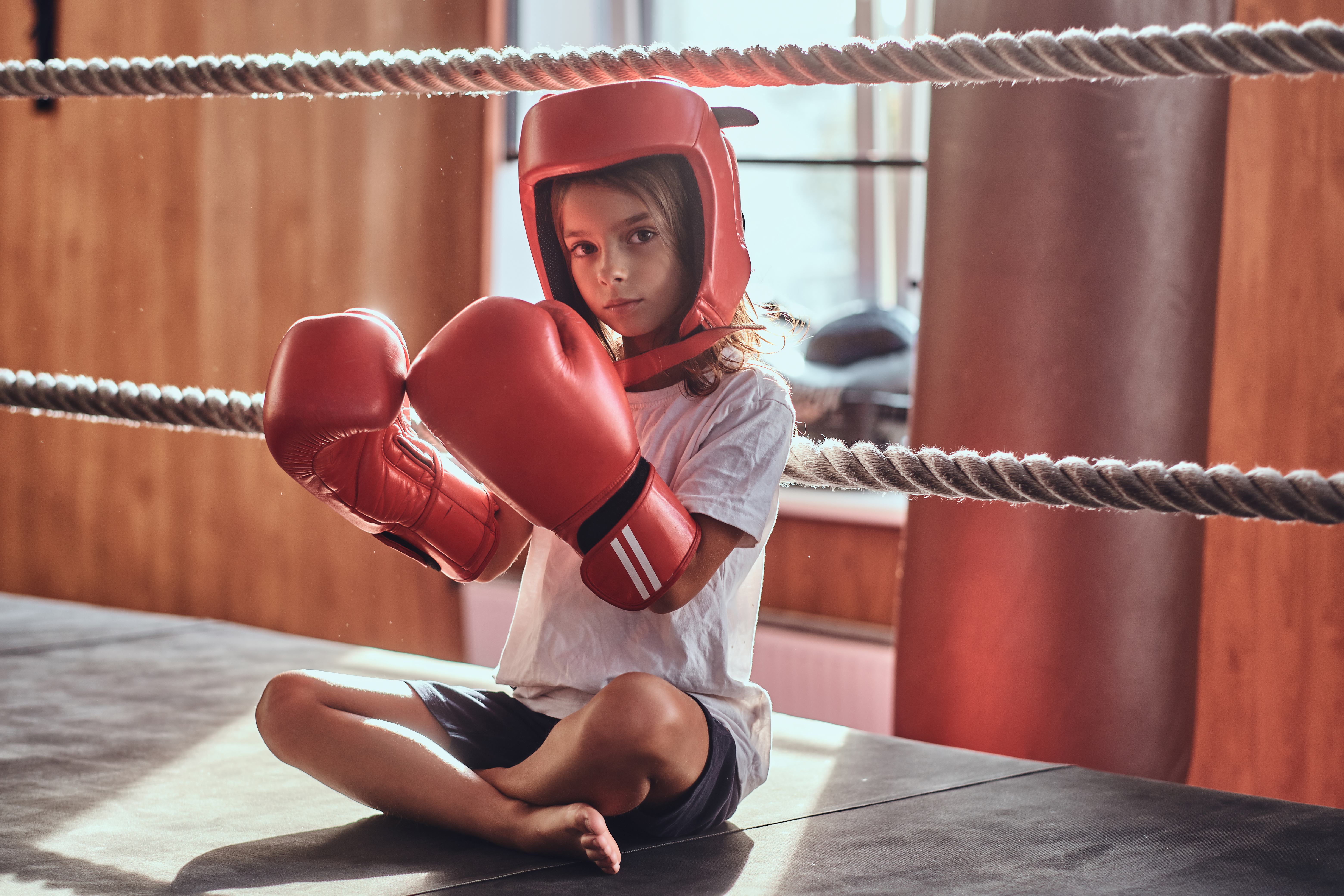 Kids doing MMA training in martial arts gym